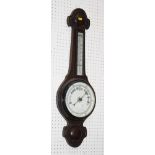 An aneroid barometer in oak case