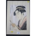 A 19th Century Japanese woodblock print, woman reading with lustre background, in strip frame