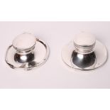 Two silver capstan inkwells