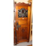A Victorian walnut hall wardrobe enclosed panelled door inset leaded light, 23" wide