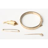 A 9ct gold hinged bangle, a 9ct gold bar brooch, a yellow metal and pearl mounted stick pin and a