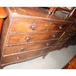 A Georgian mahogany chest fitted two short and three long drawers with turned wood knobs, on splayed