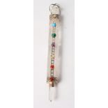 A rock crystal Yad/Torah pointer with white metal mounts set semi-precious cabochons, 8" long