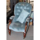 A 19th Century mahogany framed open armchair, button upholstered in a blue velour, on turned