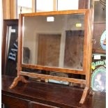 A 19th Century mahogany framed dressing mirror, on square reeded supports, 17" wide