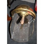 A brass coal scuttle, a brass framed spark guard and a Chinese bronze hand mirror