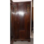 An early 20th Century oak hall robe inset two leaded glazed panels, 32" wide