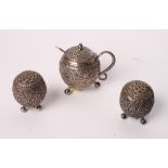 An Indian white metal three-piece cruet set with embossed decoration, 6.3oz troy approx