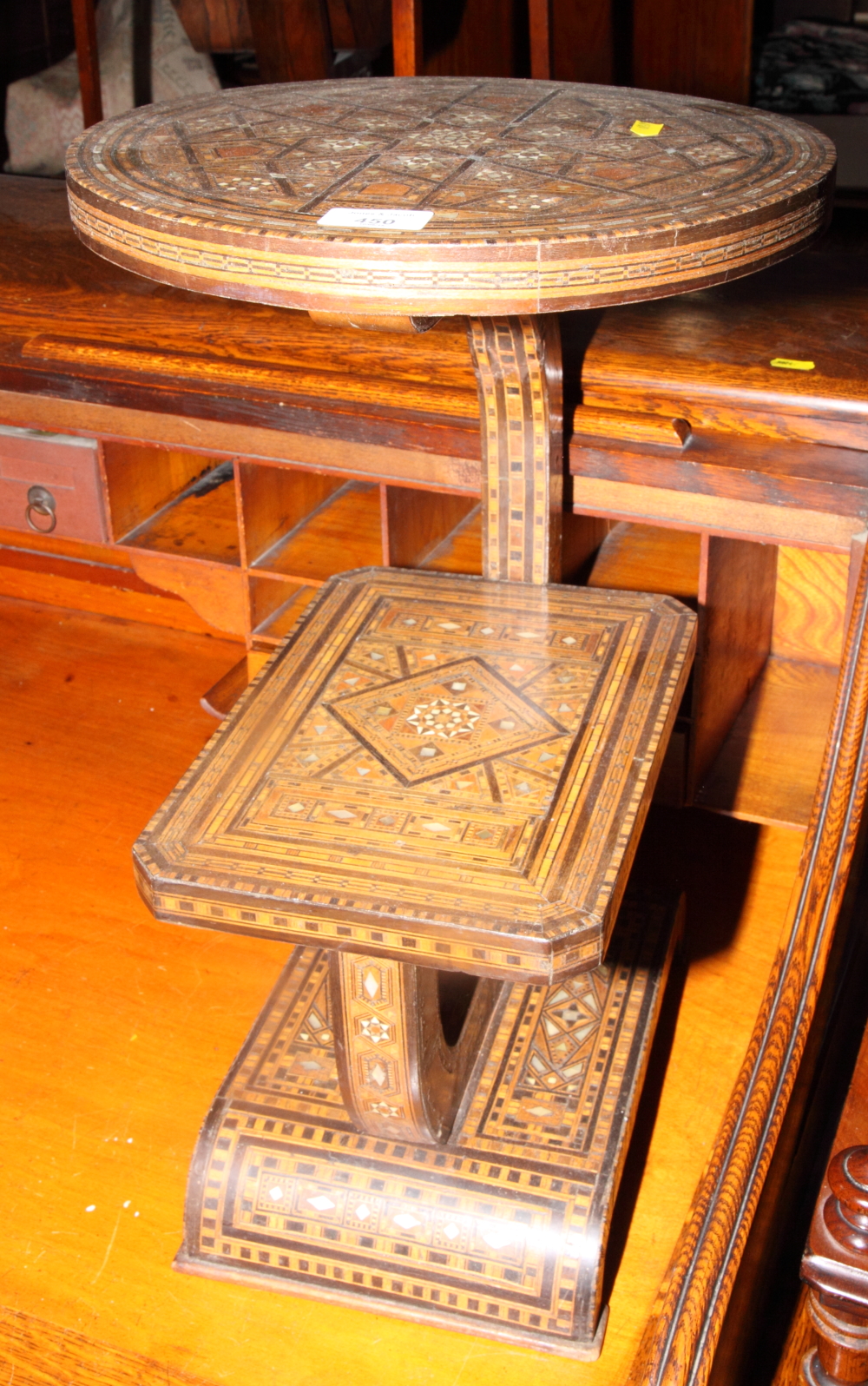 A Middle Eastern parquetry decorated two-tier occasional table inlaid mother-of-pearl, 12" dia