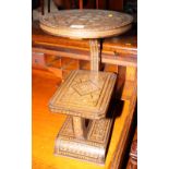 A Middle Eastern parquetry decorated two-tier occasional table inlaid mother-of-pearl, 12" dia