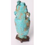 A 19th Century Chinese carved turquoise vase of flattened form, sides carved stylised dragons,