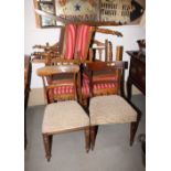 A set of six Arts & Crafts oak dining chairs, three pierced splats to back, stuffed over seats