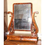 A Victorian mahogany swing mirror with scroll standards carved grapes, base fitted two drawers