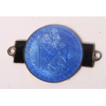 Motoring interest: a silver St Christopher dashboard plaque with blue and black enamel decoration by