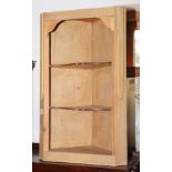 A pine wall mounted corner cabinet, 14" wide