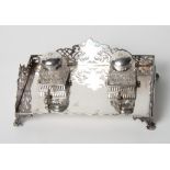 A 19th Century silver plated desk inkstand with pierced gallery and two cut glass inkwells