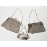 Two silver mesh evening purses and an Edwardian silver purse with engraved decoration