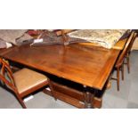 An oak refectory dining table with extension pieces, on carved base, 56" x 29" opening to 68" x 42"