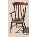 A 19th Century high spindle back kitchen armchair