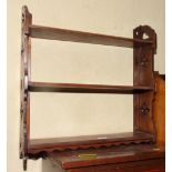 A Victorian open wall shelf, fitted three shelves with pierced sides, 22" wide
