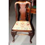 A set of eight Queen Anne design mahogany dining chairs with shell carved splats, drop-in seats