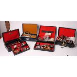 A collection of costume jewellery and four jewellery boxes