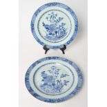 A pair of Chinese blue and white dishes with foliate decoration, 9" dia