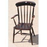 A 19th Century high spindle back kitchen armchair