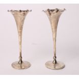 A pair of silver bud vases