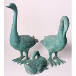 Two bronzed models of geese, 20" high, a smaller similar model of a duck preening and a circular
