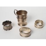 A silver christening mug and three silver napkin rings, 4.3oz troy approx