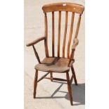 A 19th Century high lath back kitchen armchair