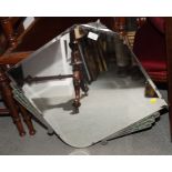 An Art Deco lozenge-shaped wall mirror with silvered and green marbled detail, 28" wide