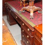 A partner's mahogany double pedestal desk with tooled lined top, fitted drawers and cupboards, on