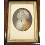 A 19th Century portrait miniature, elderly lady in bonnet, in rosewood frame