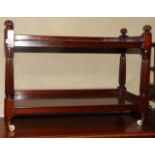 A late 19th Century polished as mahogany two-tier trolley, on castored supports, 36" wide