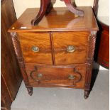 An early 19th Century mahogany pot cupboard enclosed two doors over one drawer, with spiral turned