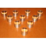 A harlequin set of ten silver napkin rings with engine turned decoration, 8.9oz troy approx