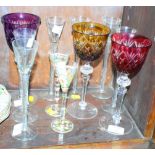 A set of six tall cordial glasses on air twist stems and five other decorative drinking glasses