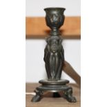A 19th Century bronze taper stick formed as a seated faun, 4 1/2" high