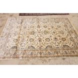 A Kashmir carpet decorated Ziegler pattern on an ivory ground, 8' x 5' approx