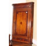 A Georgian oak and mahogany banded wall hung corner cabinet, fitted three drawers, 30" wide