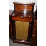 An early Victorian rosewood chiffonier with raised back and brass gallery, one door to base, 20"