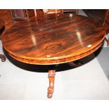 A William IV rosewood circular tilt top dining table, on carved scroll supports, 48" dia