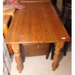 A pine rectangular kitchen table, on turned supports, 53" x 25"