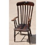 A 19th Century high lath back kitchen armchair