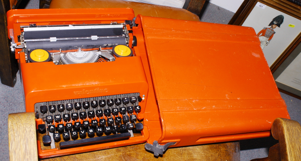 An Olivetti Valentine typewriter, in red plastic case