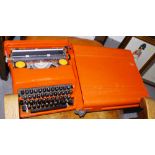 An Olivetti Valentine typewriter, in red plastic case