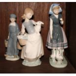 Three Lladro porcelain figures of a Dutch boy carrying milk, a Breton peasant girl with two geese