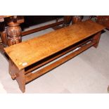 An oak panel end bench with triple stretchers, 53" long